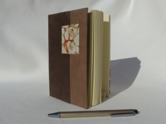 Lined notebook, parchment spine, brown