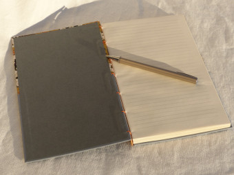 Lined notebook, criss-cross technique, grey