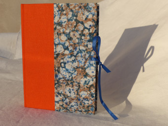 Lined notebook, lace tied, orange cloth