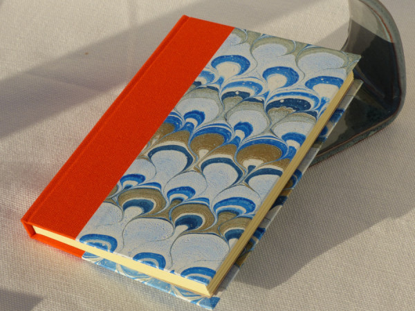 Orange cloth bound notebook