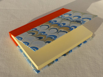 Orange cloth bound notebook
