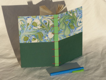 Lined notebook, criss-cross technique, green